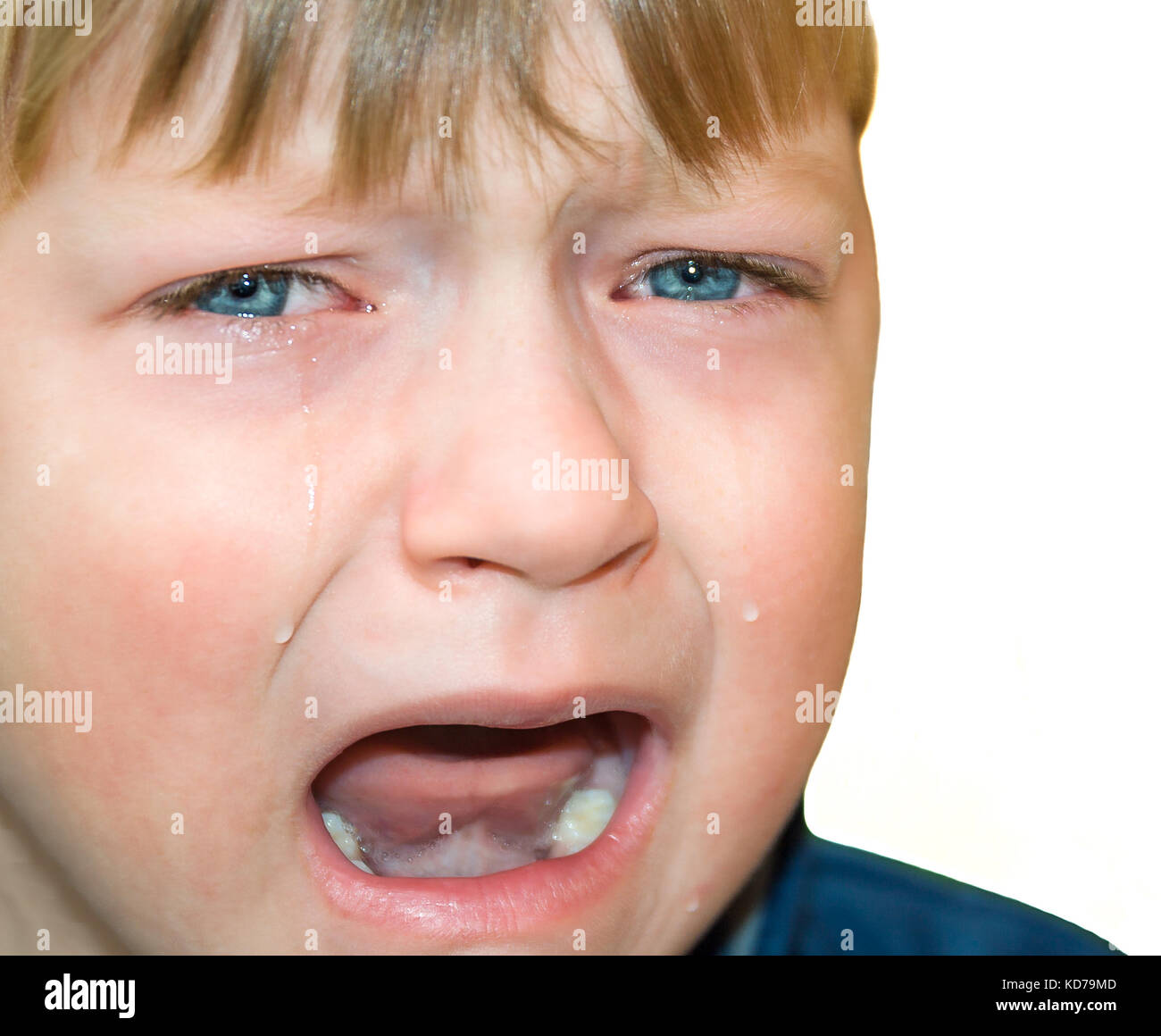 little boy was crying from hurt, tears stream down cheeks. emotion child sadness. kid cry isolated on white background Stock Photo