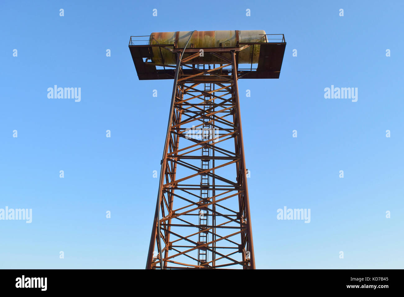 Rusty water tower. An old rustic communal communication Stock Photo - Alamy