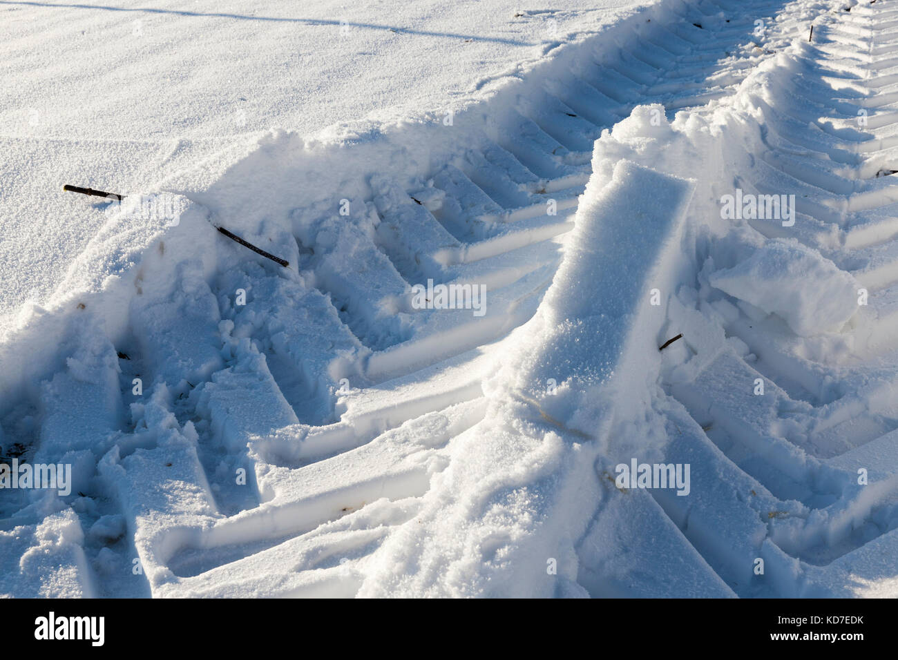 Traces of the car on the snow Stock Photo - Alamy