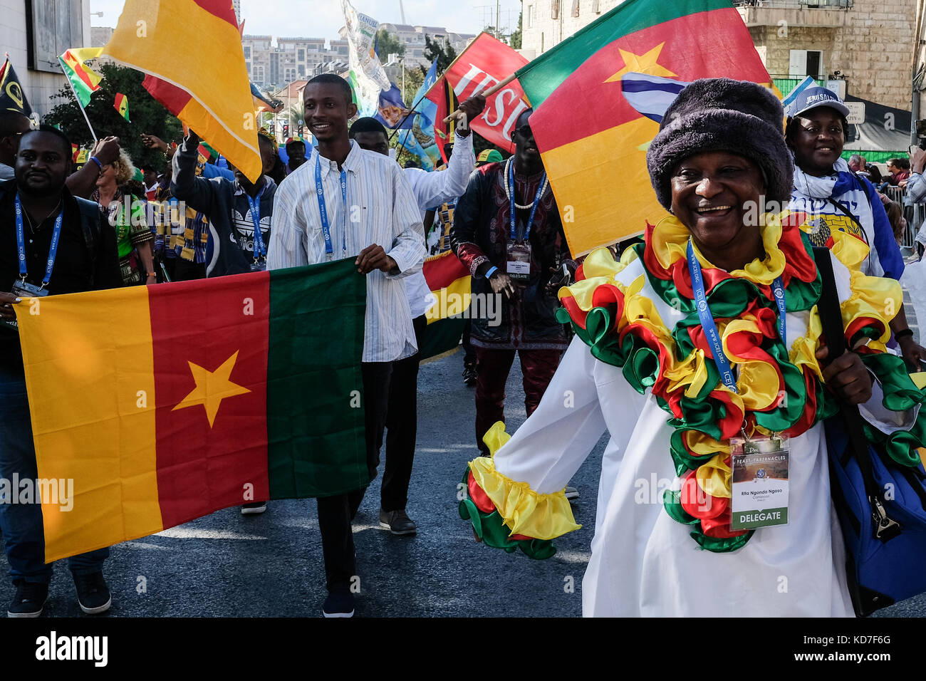 Jerusalem, Israel. 10th Oct, 2017. A member of the Cameroon delegation to the International Christian Embassy Jerusalem annual Feast of Tabernacles marches up Bezalel Street in the annual Jerusalem Parade. Tens of thousands marched in the annual Jerusalem Parade including delegations from around the world, Israeli industry, banks, emergency and military personnel, in the tradition of Temple Mount pilgrimages on the holiday of Sukkoth and in a show of international support for Israel. Credit: Nir Alon/Alamy Live News Stock Photo