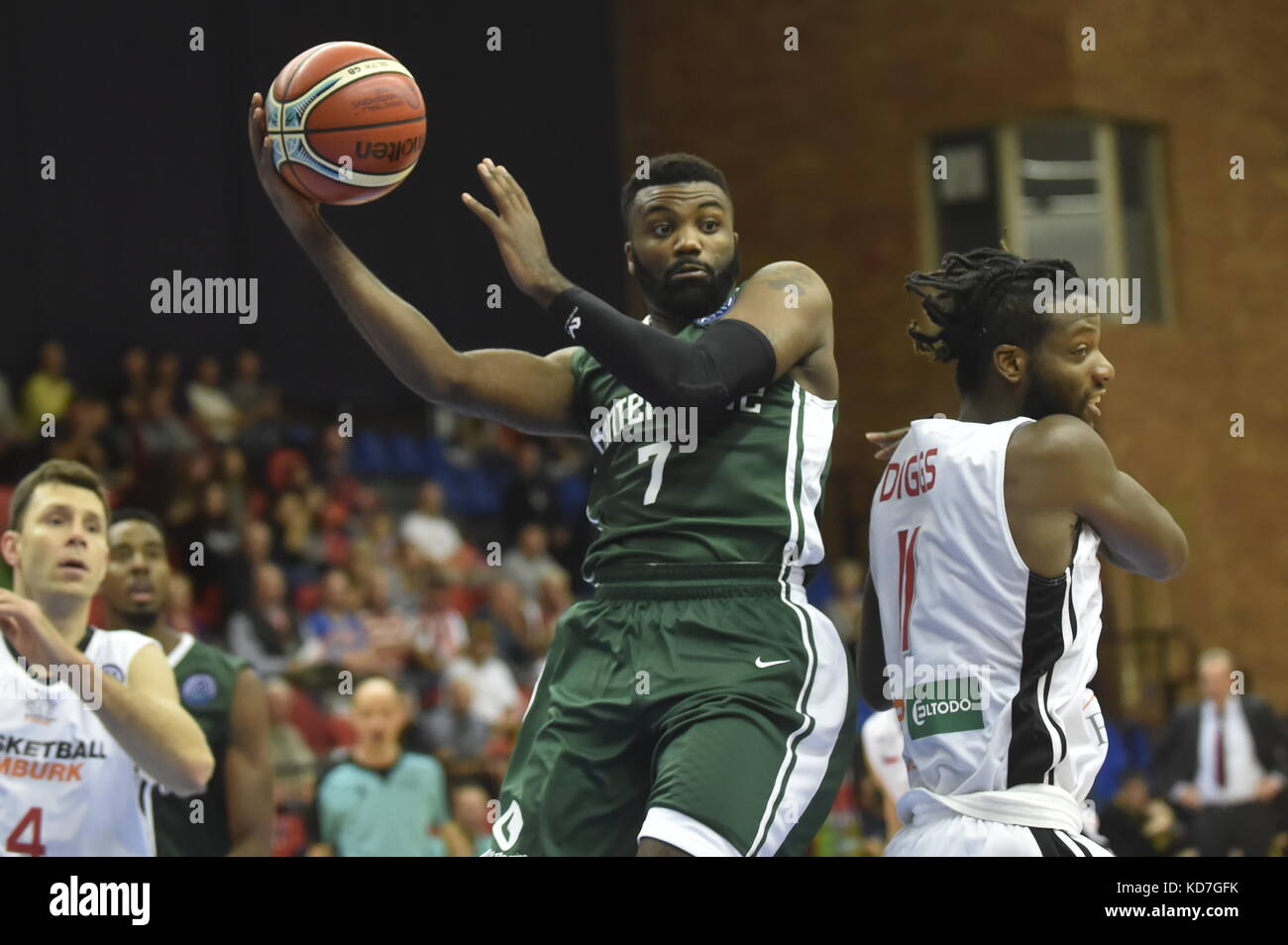 Nymburk, Czech Republic. 10th Oct, 2017. Jamal Shuler of Nanterre, center, Quincy Diggs of Nymburk, right, and Petr Benda of Nymburk, left, in action during the Champions Basketball League group D first round match Nymburk vs Nanterre in Nymburk, Czech Republic, October 10, 2017. Credit: Josef Vostarek/CTK Photo/Alamy Live News Stock Photo
