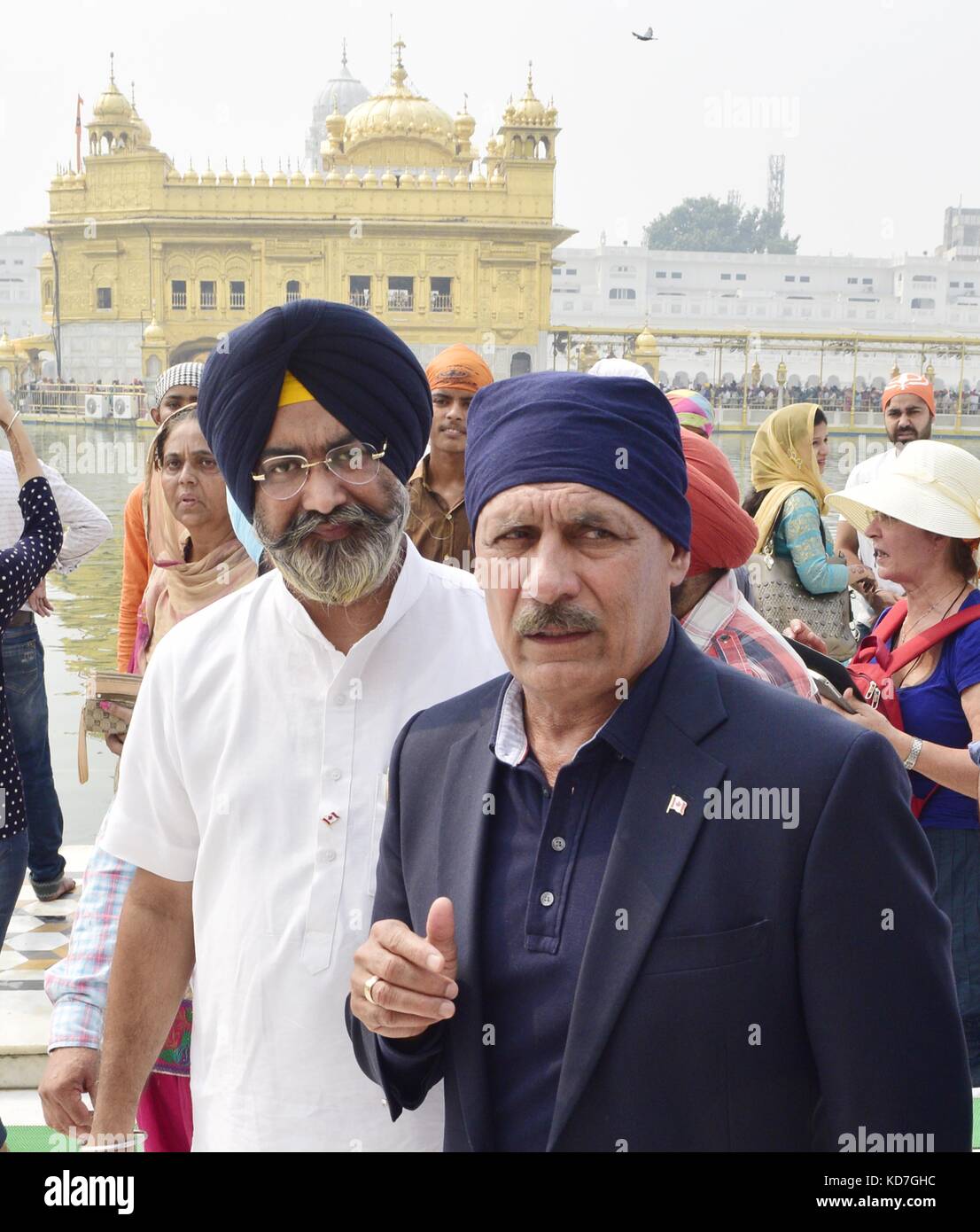 Amritsar, India. 10th October, 2017. Member of Parliament from Canada Jatinder Singh Sidhu (R) with others paying obeisance at Golden Temple during his visit. Photo Credit: Sameer Sehgal/Newscom/Alamy Live News Stock Photo