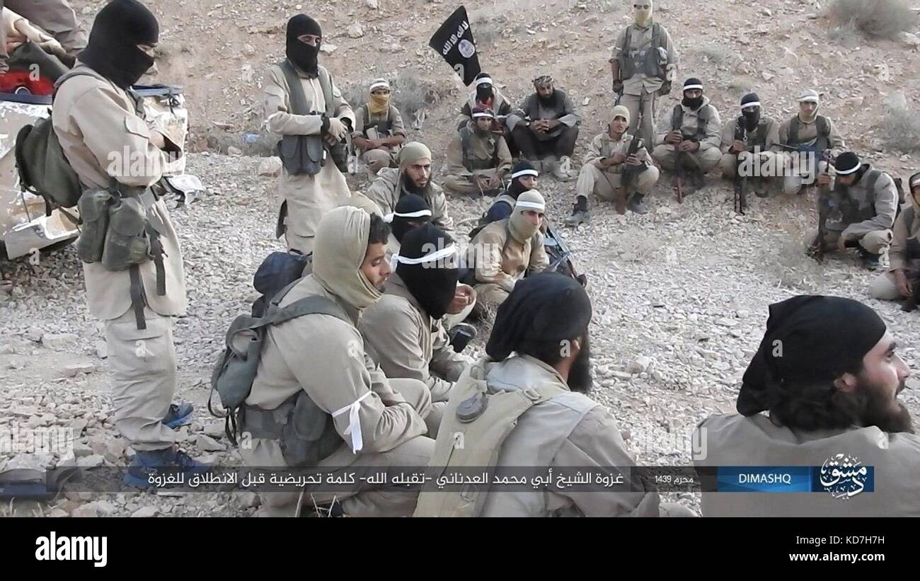 Al Qaryatayn, Syria. 10th Oct, 2017. Still image taken from an ISIS propaganda video released October 10, 2017 showing Islamic State militants gather for battle near Qaryatain, Syria. After losing territory the Islamic State staged a week-long counterattack seizing the central Syrian town near Palmyra. Credit: Planetpix/Alamy Live News Stock Photo