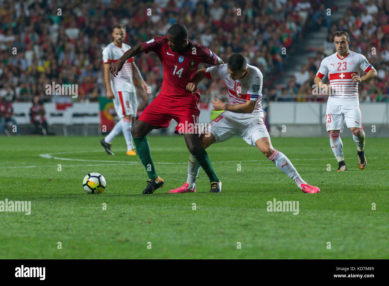 Lisbon, Portugal. 10th Oct, 2017. Portugal's midfielder William Carvalho (14) and Switzerland's midfielder Granit Xhaka (10) during the FIFA 2018 World Cup Qualifier between Portugal and Switzerland Credit: Alexandre de Sousa/Alamy Live News Stock Photo