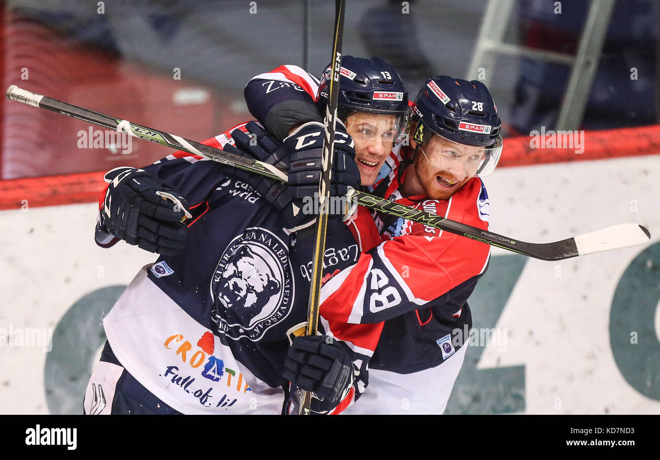 Zagreb, Croatia. 10th Oct, 2017. Sondre Olden (L) and Michael Boivin of KHL Medvescak celebrate after scoring a goal during the EBEL (Erste Bank Eishockey Liga) ice hockey league match between KHL Medvescak and EC VSV in Zagreb, Croatia, on Oct. 10, 2017. KHL Medvescak won 5-2. Credit: Igor Soban/Xinhua/Alamy Live News Stock Photo