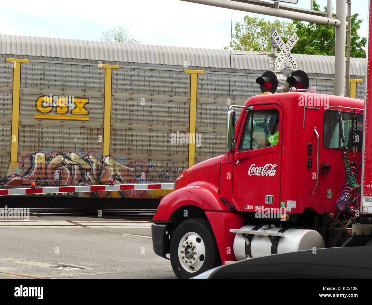 Coca Cola truck at railroad crossing. Stock Photo