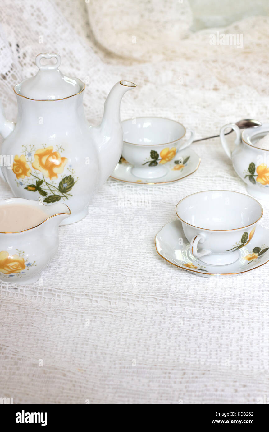 Porcelain tea pot and cup of hot tea on the table, antique traditional  crockery set, high tea English afternoon tea Stock Photo - Alamy
