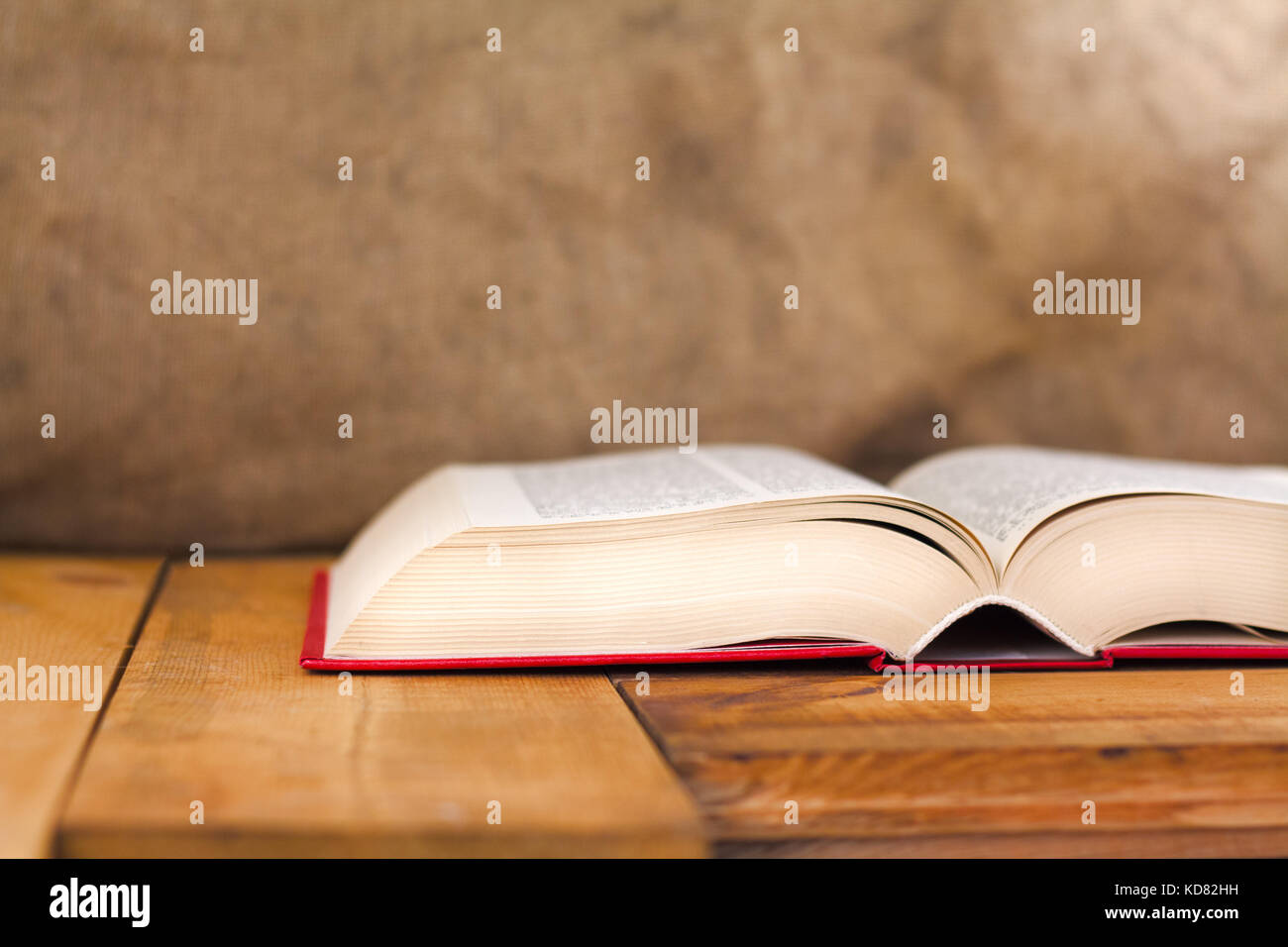 Composition with vintage old hardback books on wooden desk table. Education background. Stock Photo