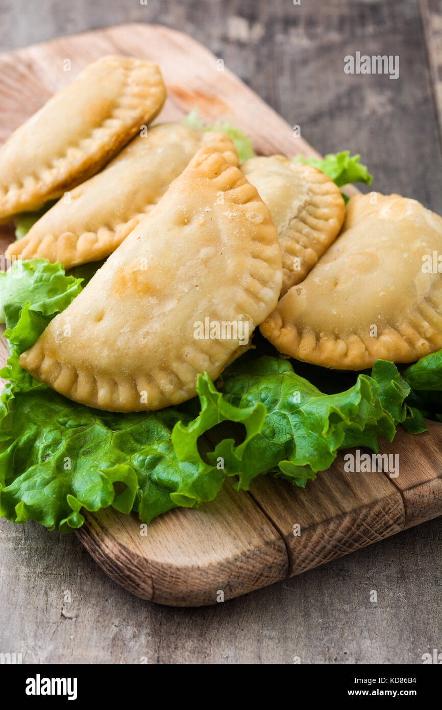 Typical Spanish empanadas on wooden table Stock Photo Alamy