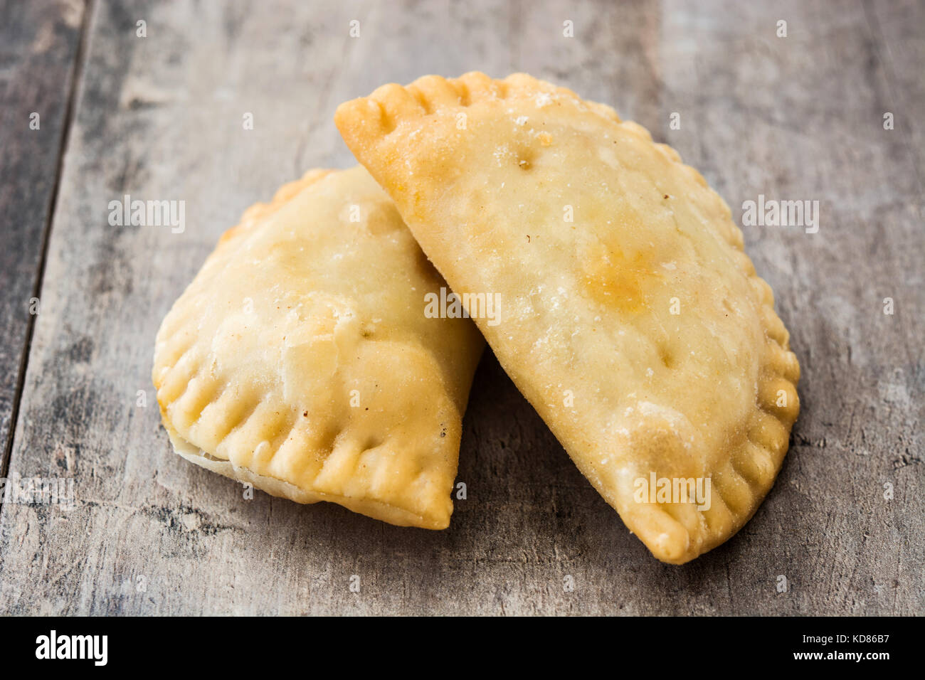 Typical Spanish empanadas on wooden table Stock Photo Alamy