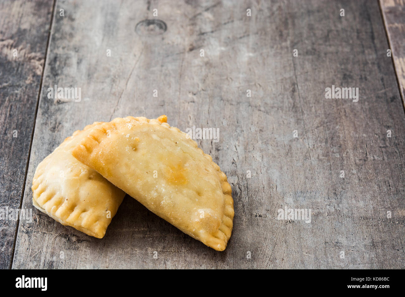 Typical Spanish empanadas on wooden table Stock Photo Alamy