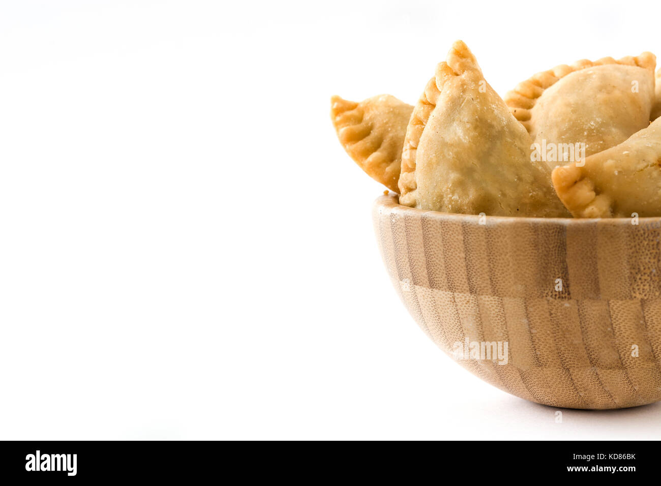 Typical Spanish empanadas in bowl isolated on white background Stock