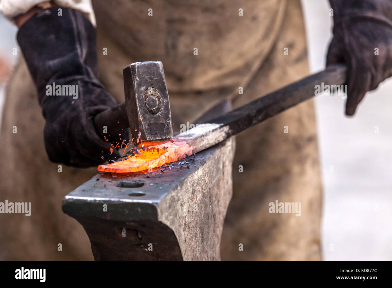Anvil In Use Blacksmith working on metal on anvil at forge high speed detail shot ...