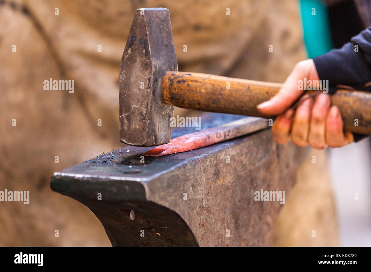 Anvil Working Blacksmith working on metal on anvil at forge detail shot Stock Photo ...