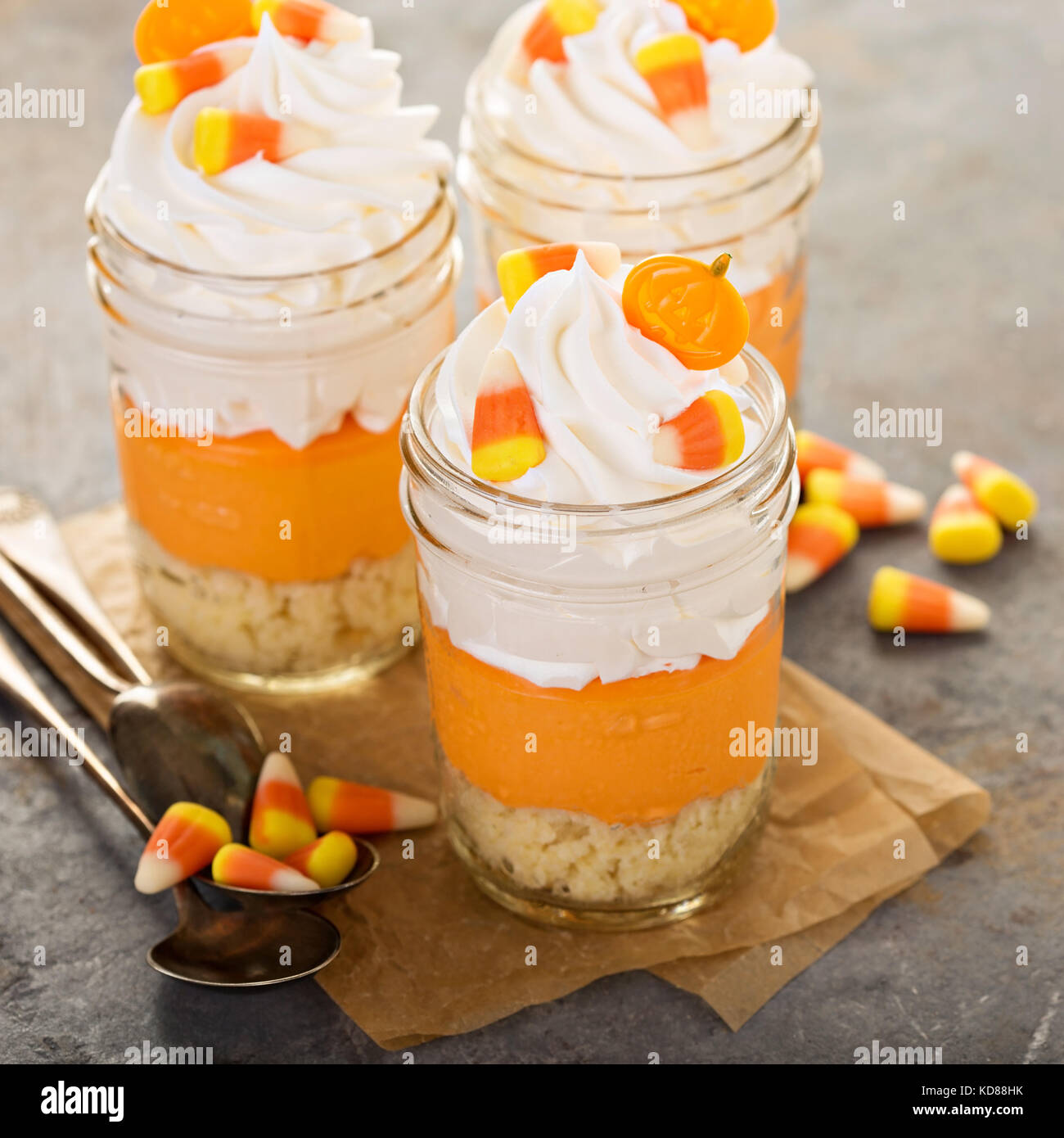 Halloween dessert in a jar layered candy corn parfait Stock Photo Alamy