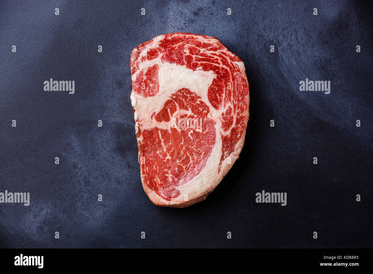 Raw fresh marbled meat Steak Rib eye Black Angus on dark background Stock Photo
