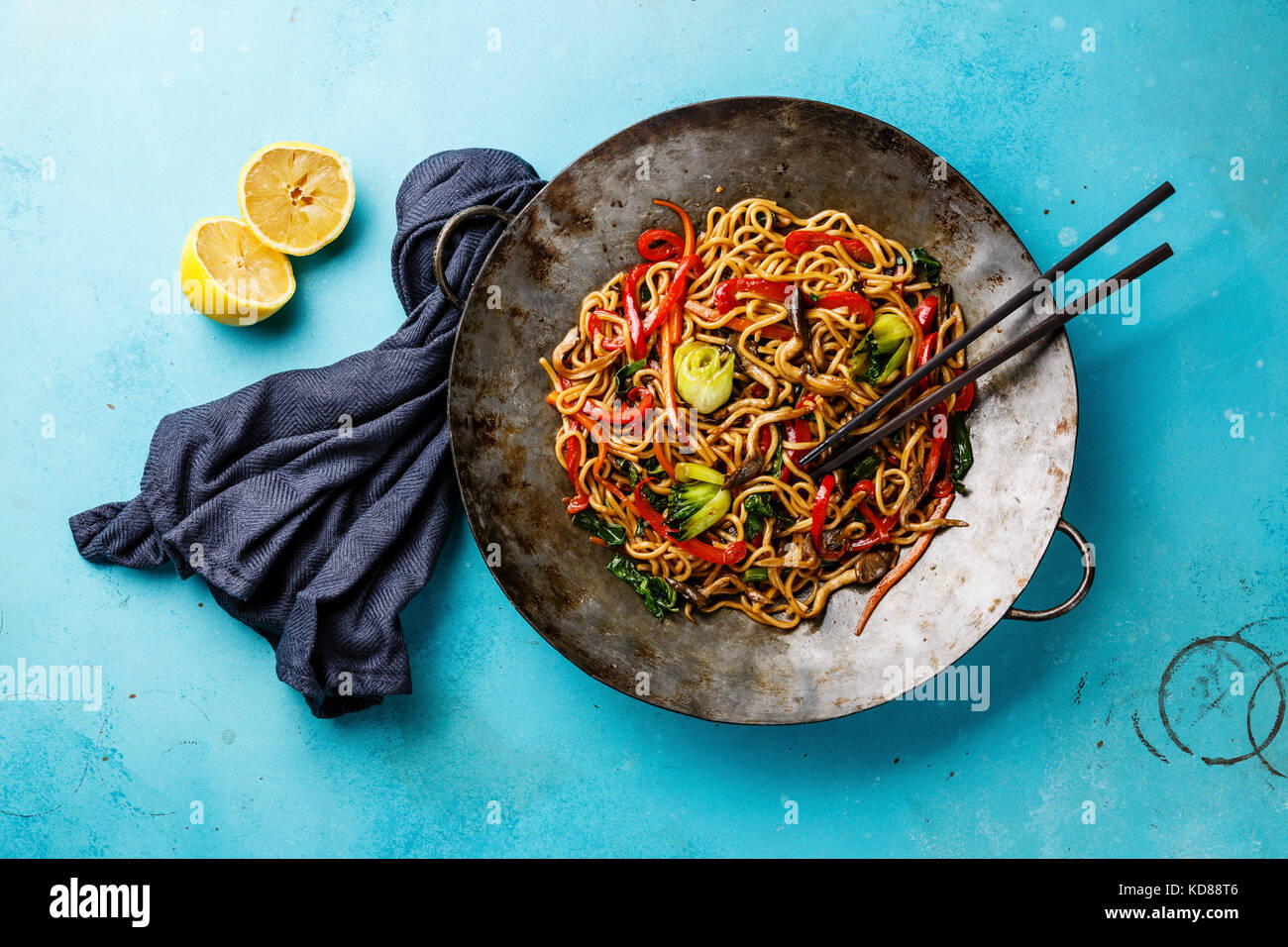 Udon stir fry noodles with oyster mushrooms and vegetables in wok pan