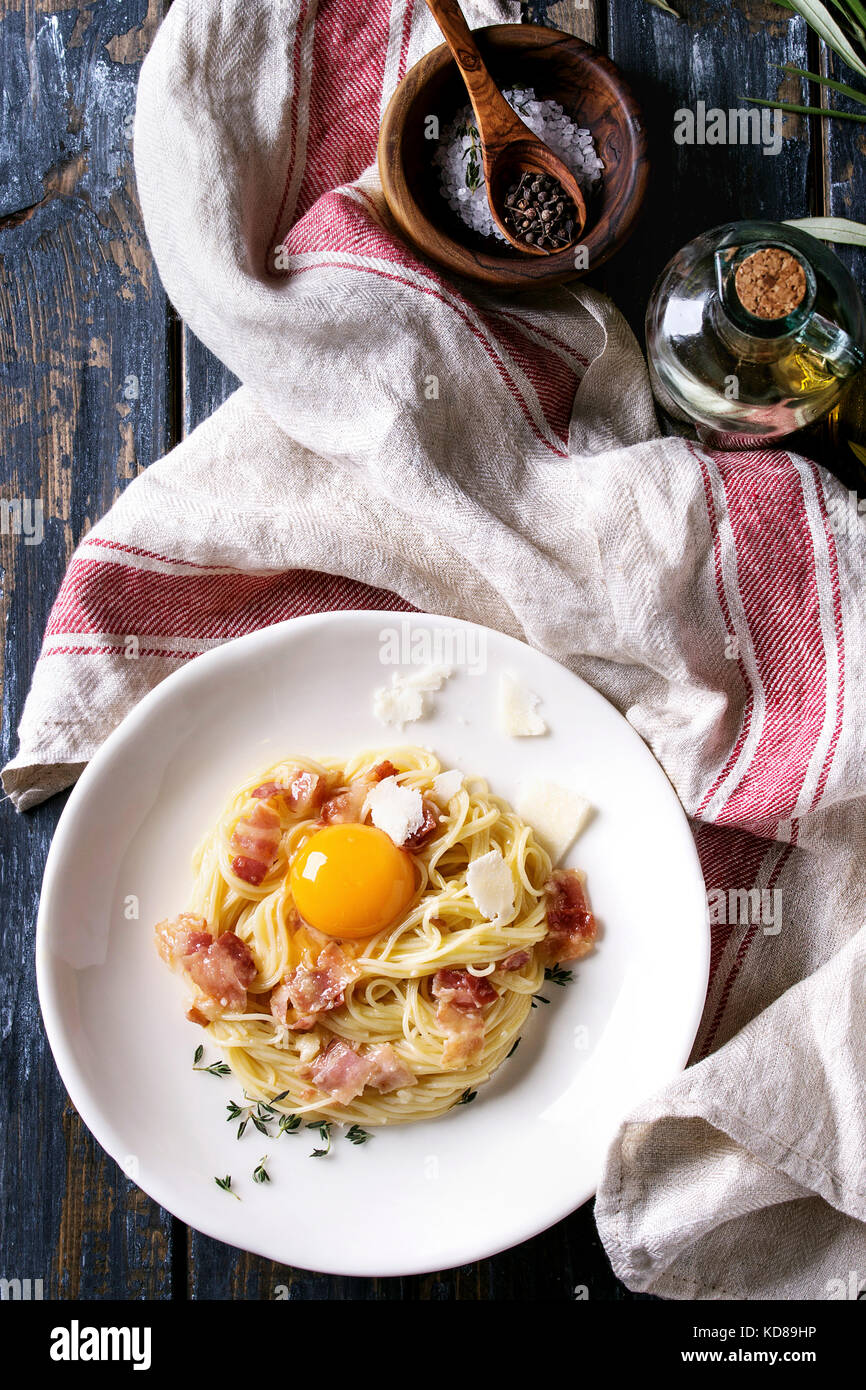 Italian traditional pasta alla carbonara with yolk, pancetta bacon