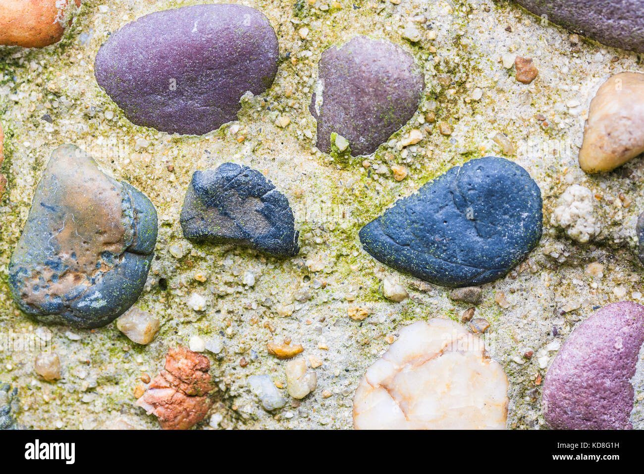 Medieval Rocks Color medieval stone wall background or texture with colorful pebbles Stock ...