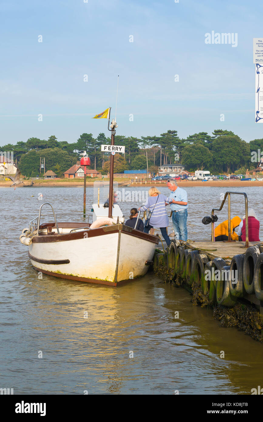 Felixstowe Ferry Suffolk, passengers on the Felixstowe side of the River Deben climb aboard the ferry to take them across to Bawdsey, UK. Stock Photo