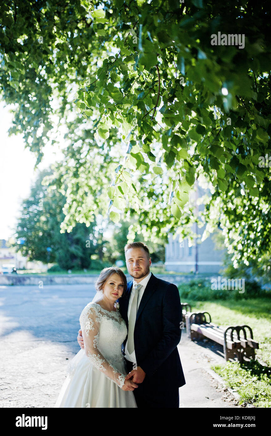 Gorgeous young couple holding hands and looking at each other on a ...
