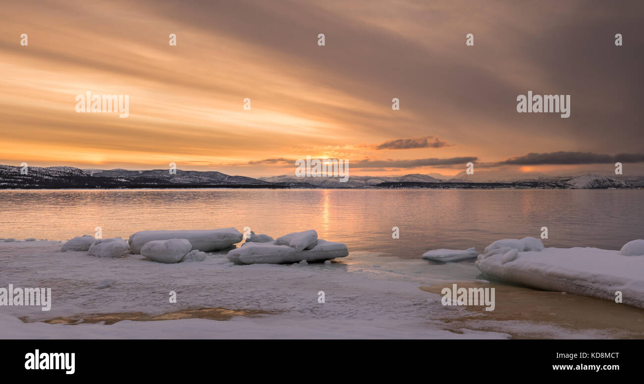 Eastern Alta fjord with ice bricks on ice covered shore Stock Photo