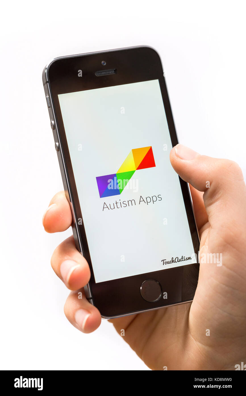 A boy using the Autism App on a mobile phone Stock Photo