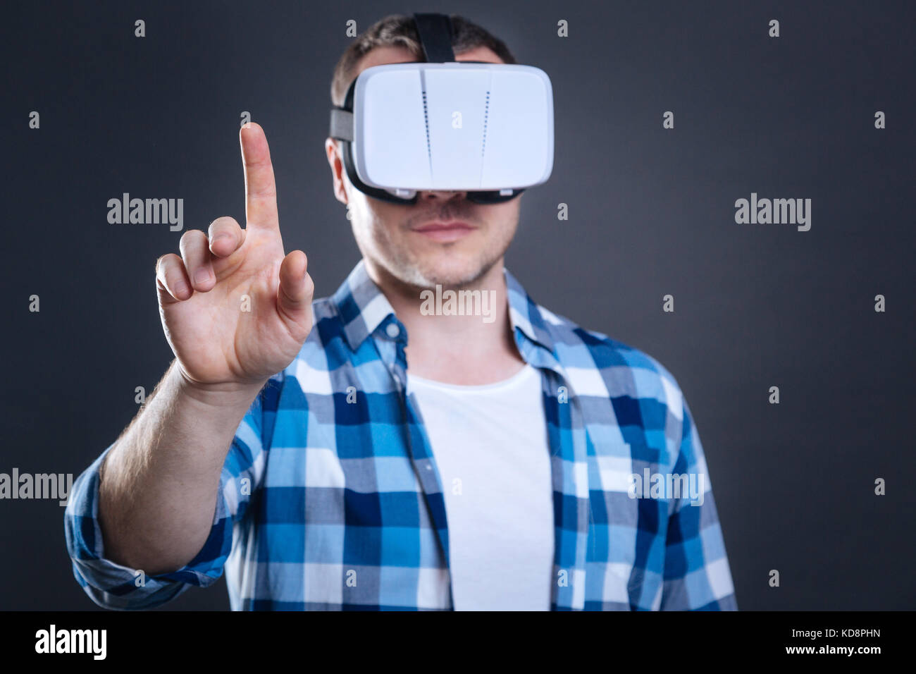 Man Using Vice Technology Nice handsome man using virtual technologies Stock Photo - Alamy