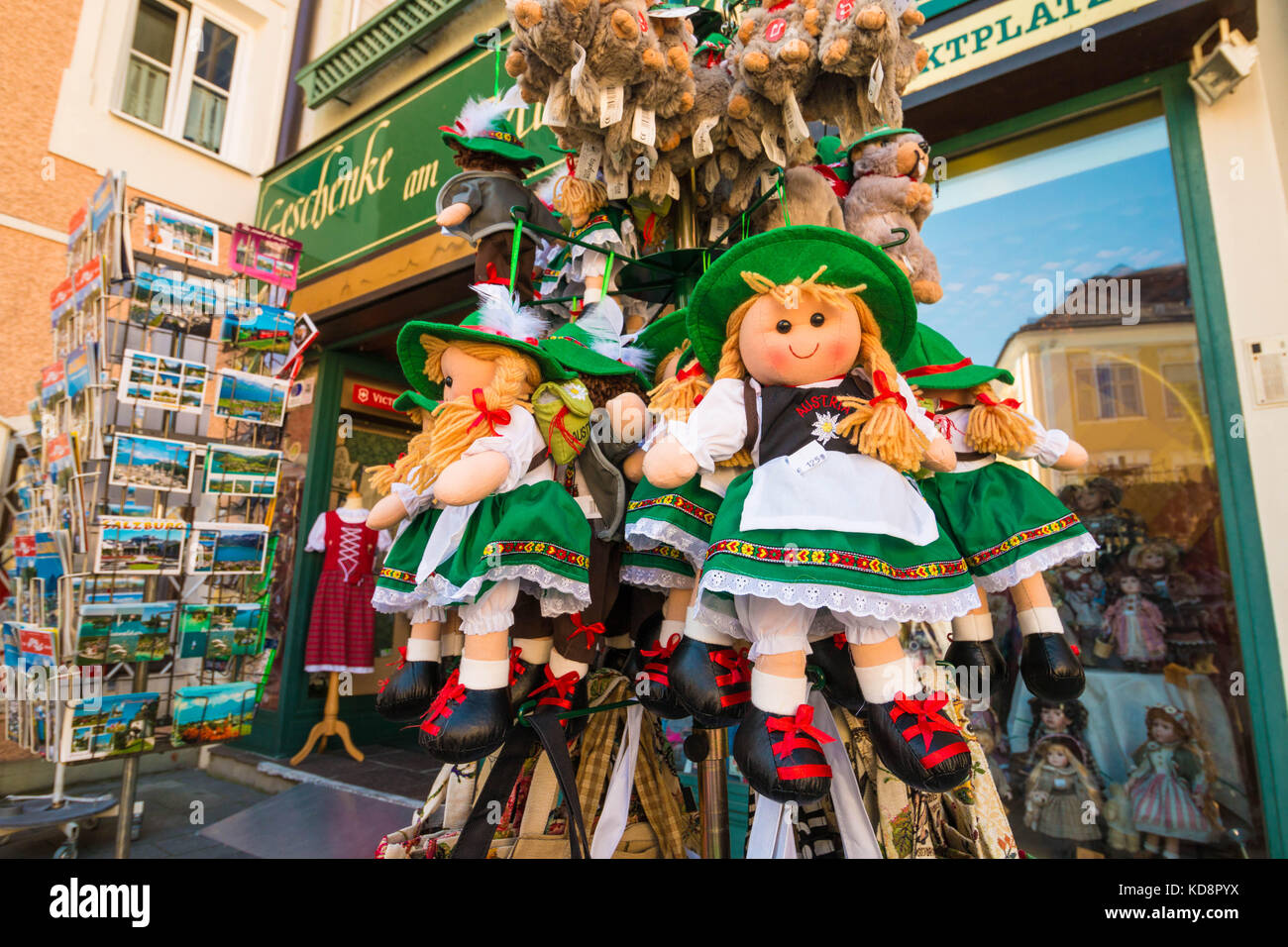 Mondsee, Austria - August 25, 2016: Souvenir stuffed cute dolls wearing dirndls displayed in front of a souvenir shop in Mondsee, Upper Austria. Stock Photo