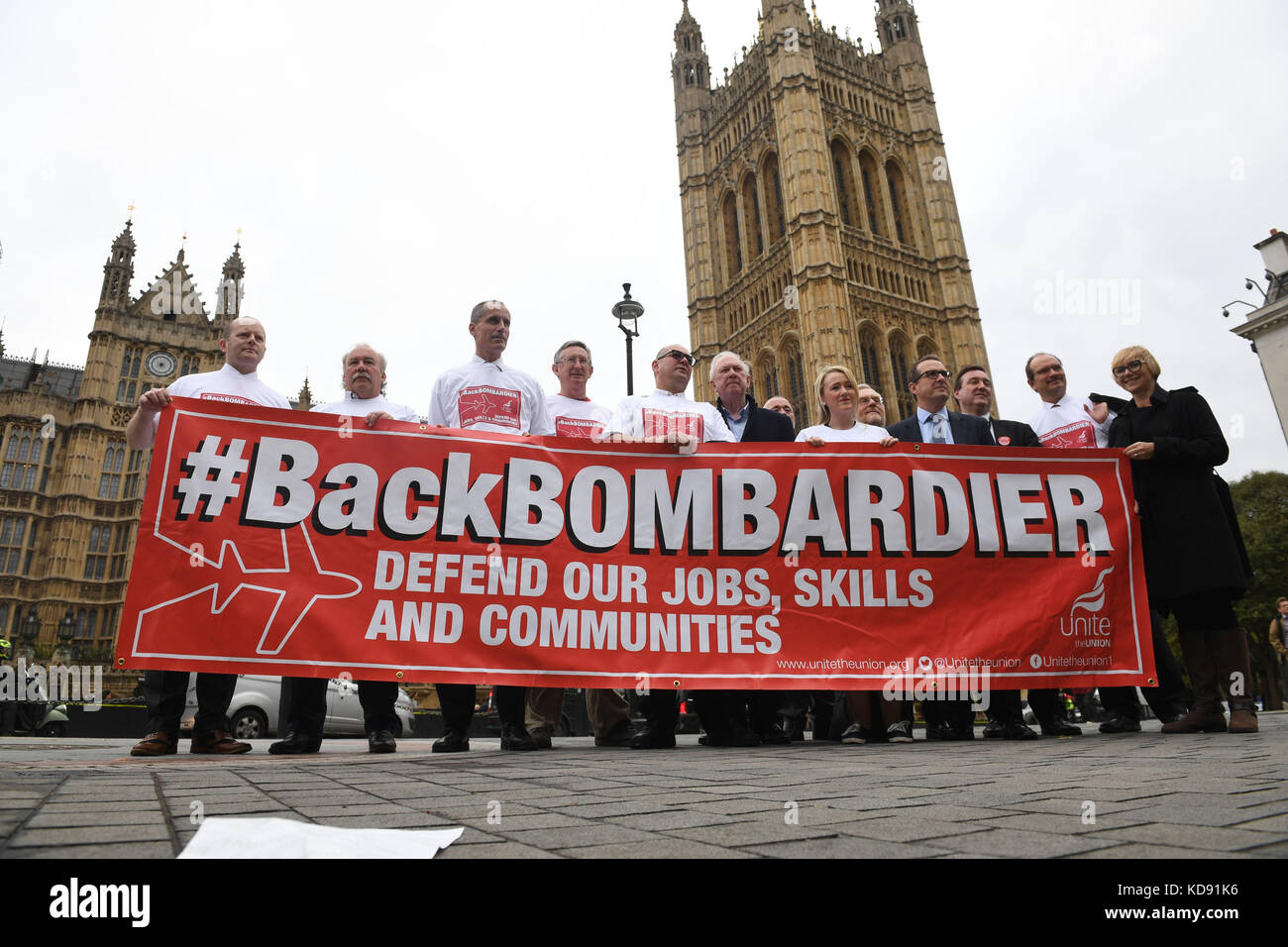 Labour MP Owen Smith (fourth right) with workers from plane manufacturer Bombardier lobbying the Houses of Parliament in central London as they press for Government action to help secure their jobs in the face of the trade dispute with the United States. PRESS ASSOCIATION Photo. PRESS ASSOCIATION Photo. Picture date: Wednesday October 11, 2017. Bombardier, which employs more than 4,000 workers in Belfast, has been hit by a proposed 80% levy on exports following complaints by Boeing that the Canadian-owned company had dumped its C Series jets at 'absurdly low' prices. See PA story INDUSTRY Bom Stock Photo