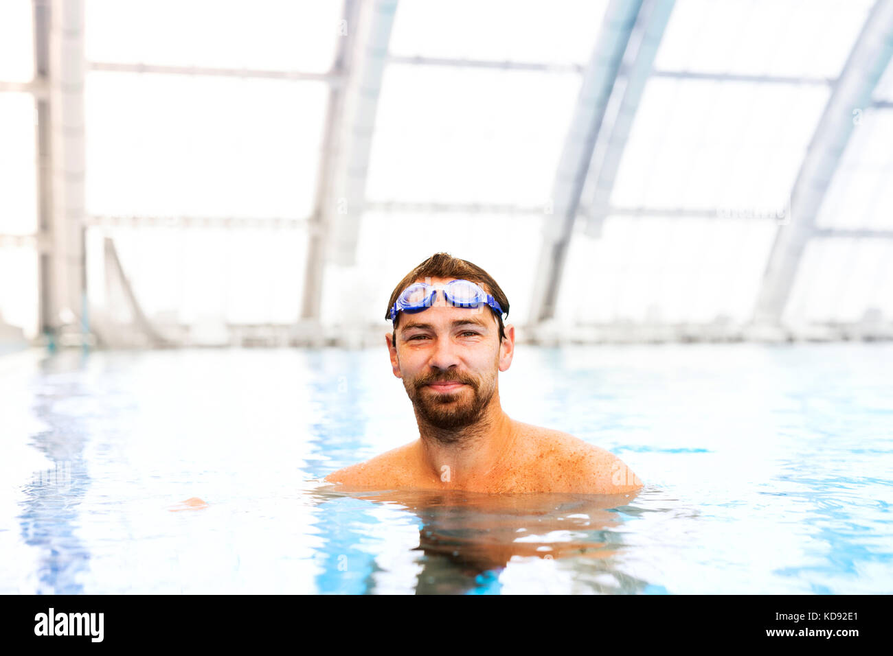 Man Swimming In An Indoor Swimming Pool Professional Swimmer