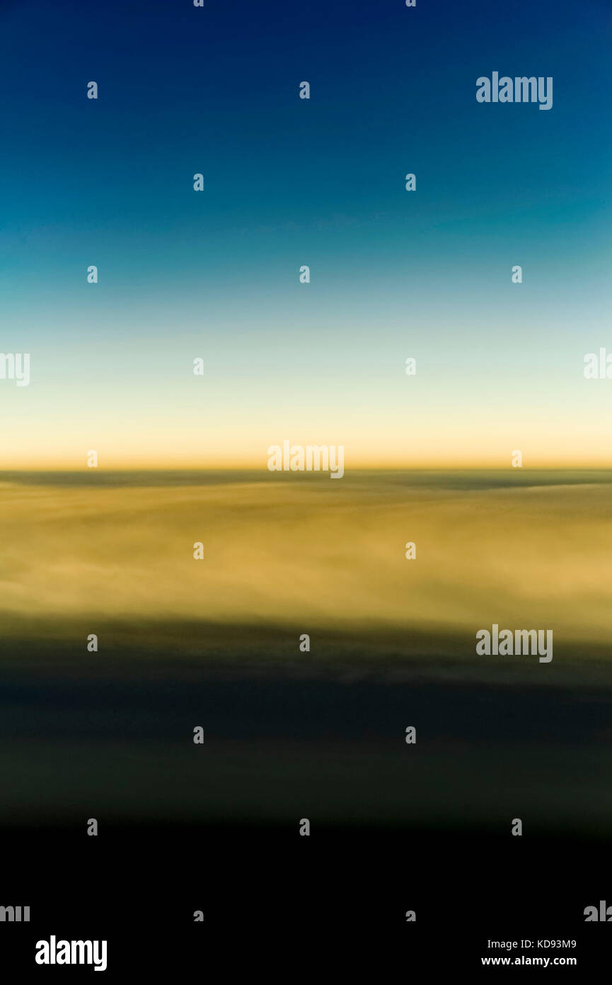 View of the clouds and sky above from the airplane window Stock Photo ...