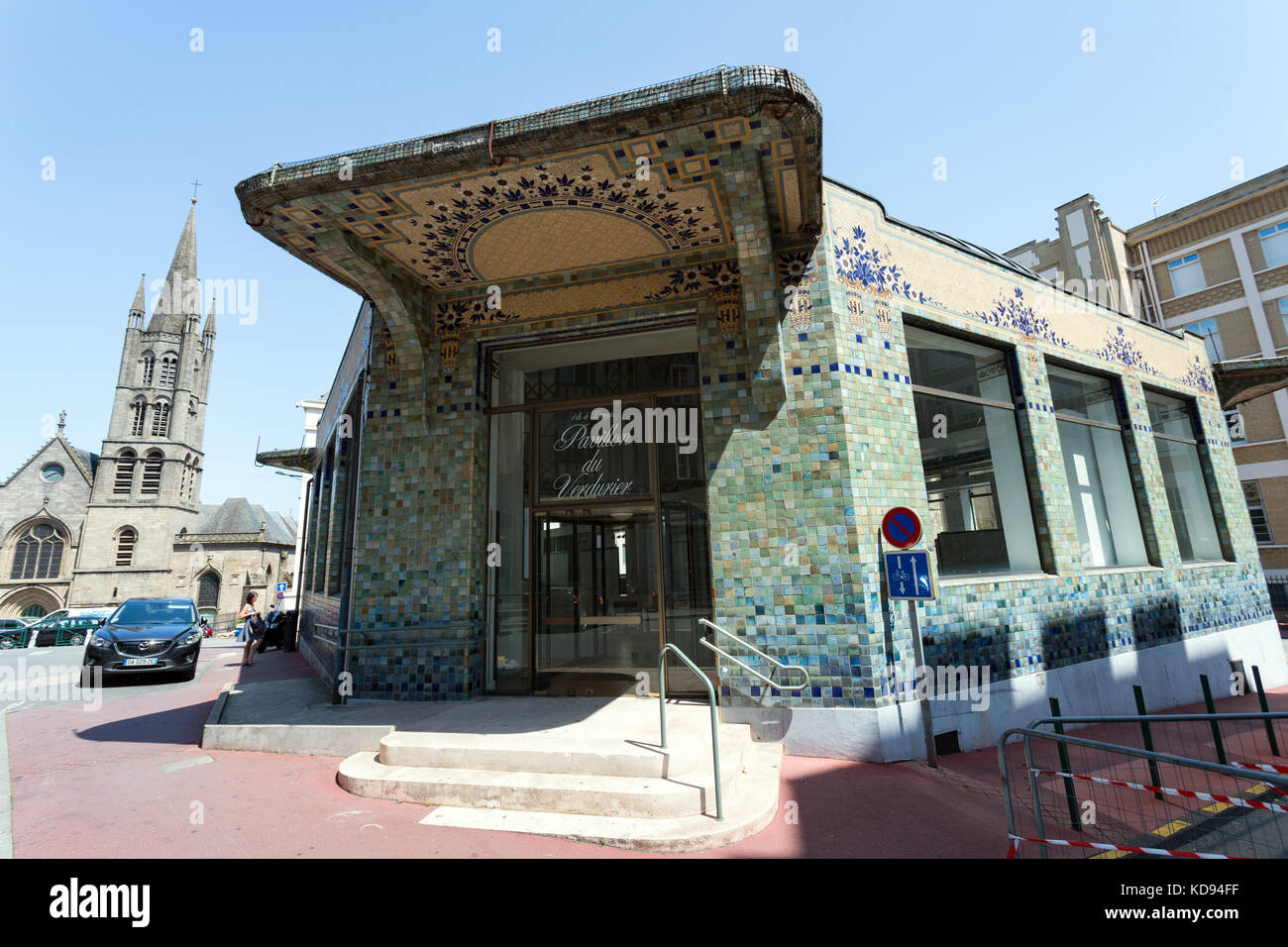 LIMOGES, LIMOUSIN, FRANCE - JULY 2, 2017: The entrance to the pavillon du Verdurier with it's mosaic walls and the Saint Pierre church in the back. Stock Photo