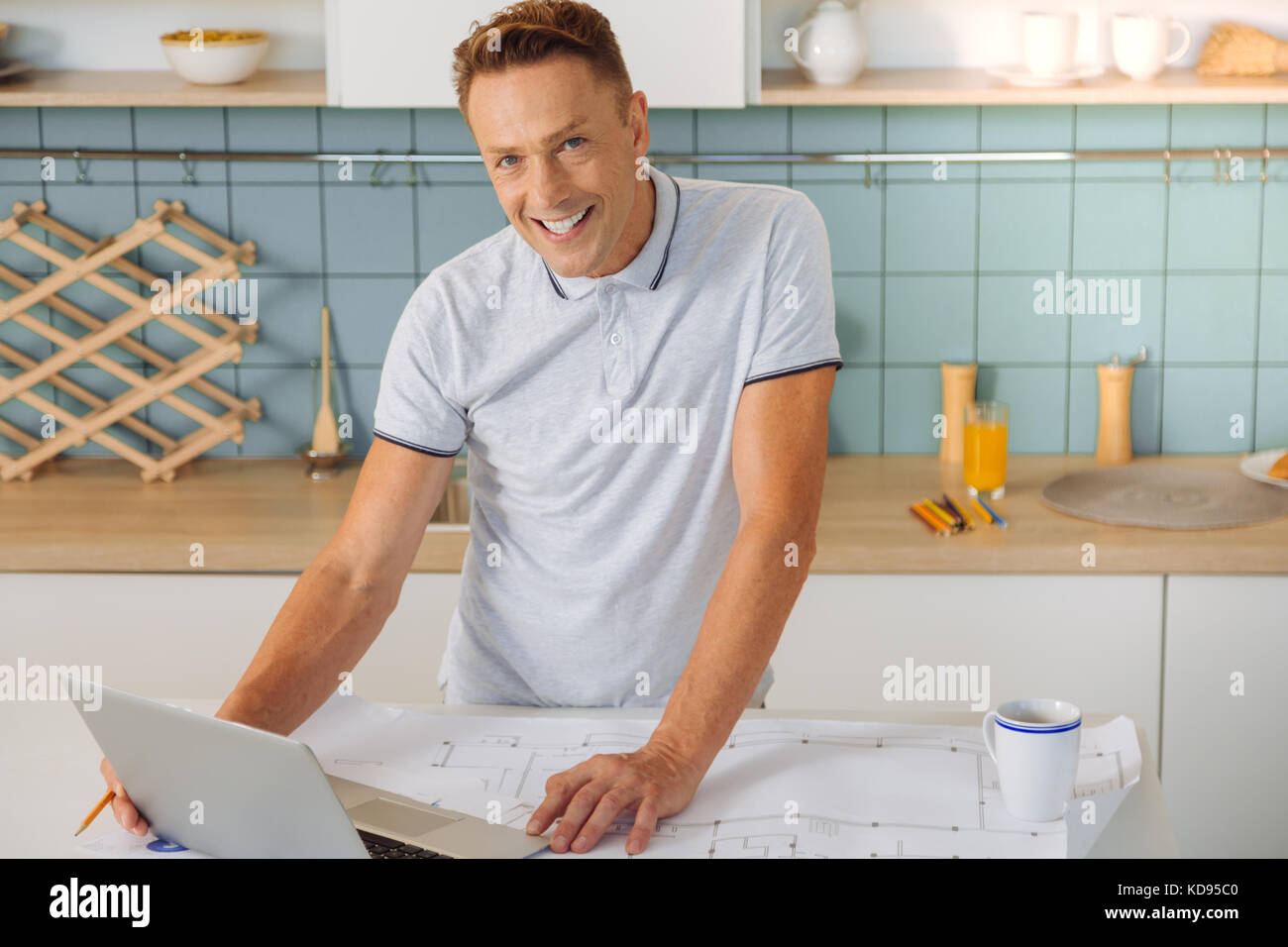 Delighted positive man being in a good mood Stock Photo