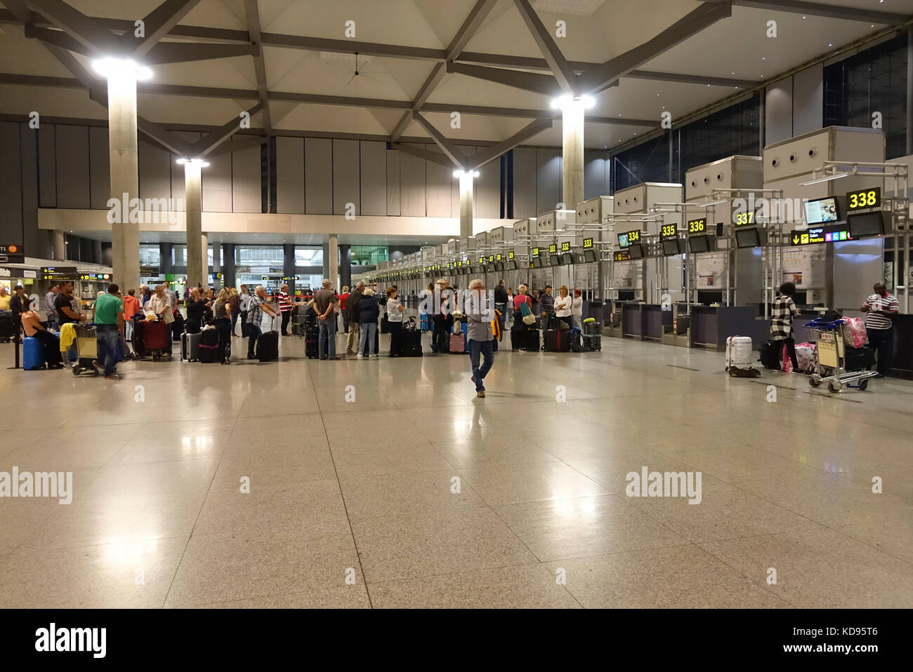 Passengers lining up at Airport check-in counters, check in counter, Malaga, Costa del sol, Spain Stock Photo