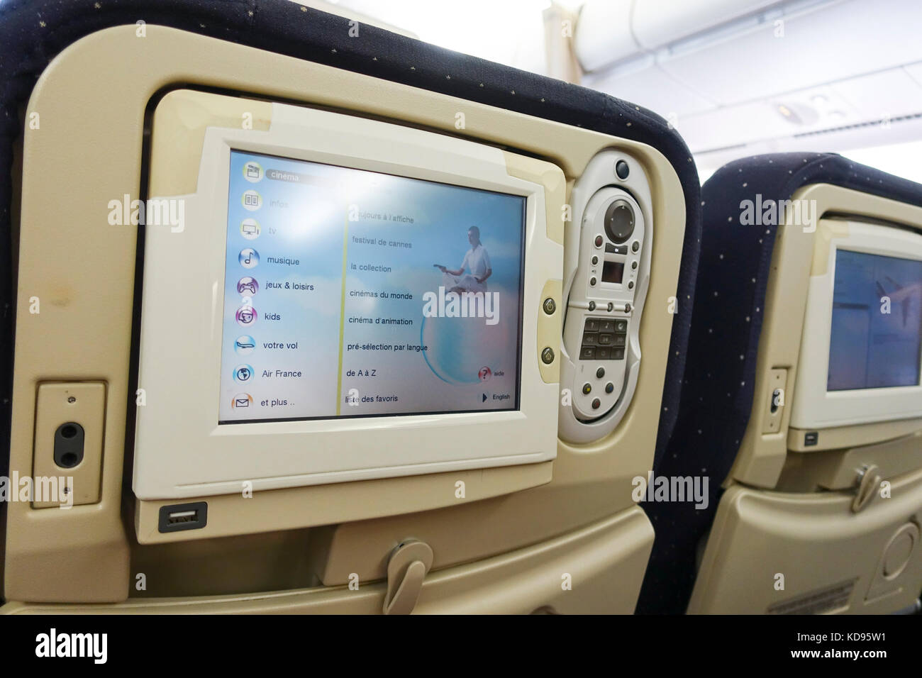 Computer screen television on back of airplane seat of Air France flight. Stock Photo