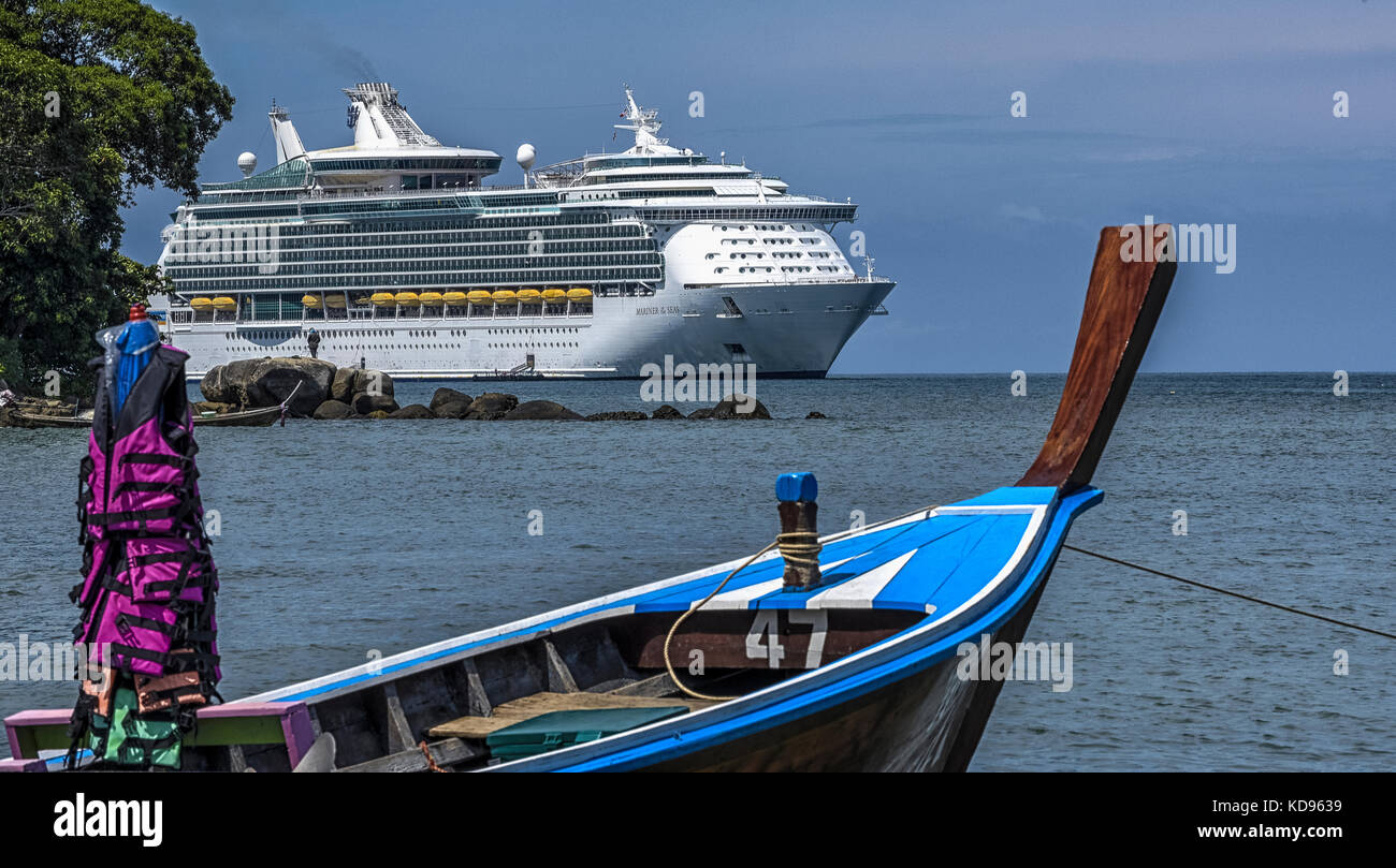 Thailandia Patong Beach cruise ship in rake and typical Thai boat Stock
