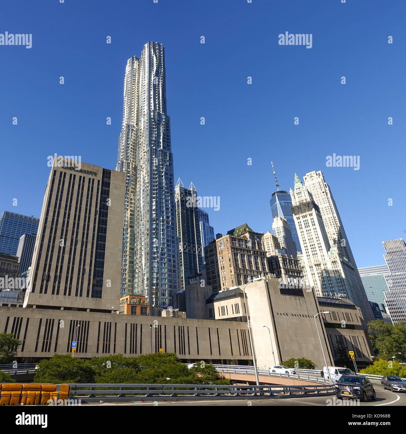 8 Spruce Street tower, and Pace private university in front, Woolworth Building (r), New york, Lower manhattan, United states. Stock Photo