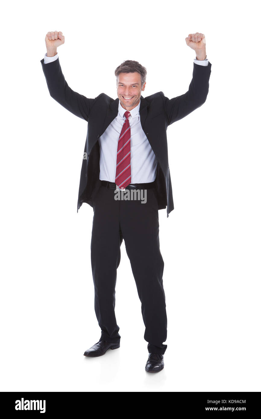 Portrait Of Excited Mature Businessman With Hand Raised Stock Photo - Alamy