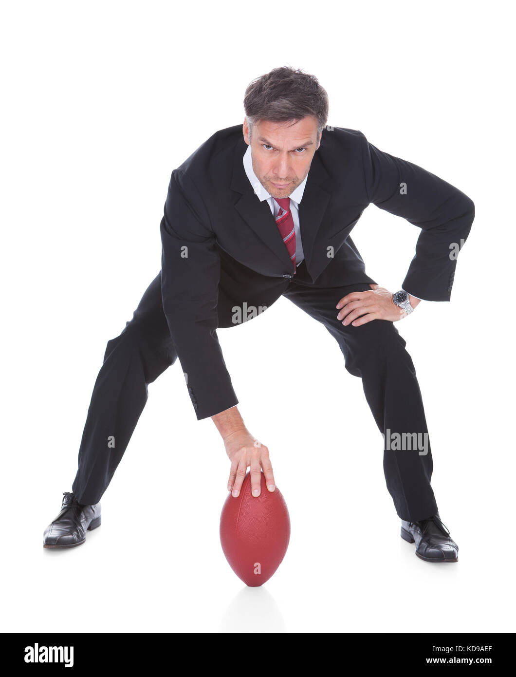 Portrait Of Mature Businessman Ready To Play American Football Stock Photo
