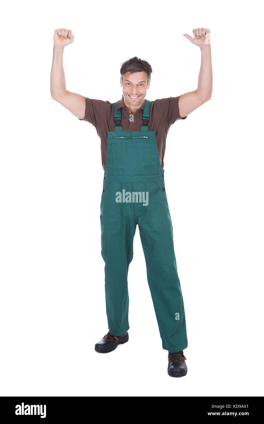 Portrait Of Excited Mature Male Gardener With Hand Raised Stock Photo
