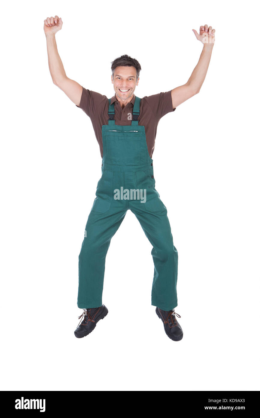 Portrait Of Excited Mature Male Gardener With Hand Raised Stock Photo