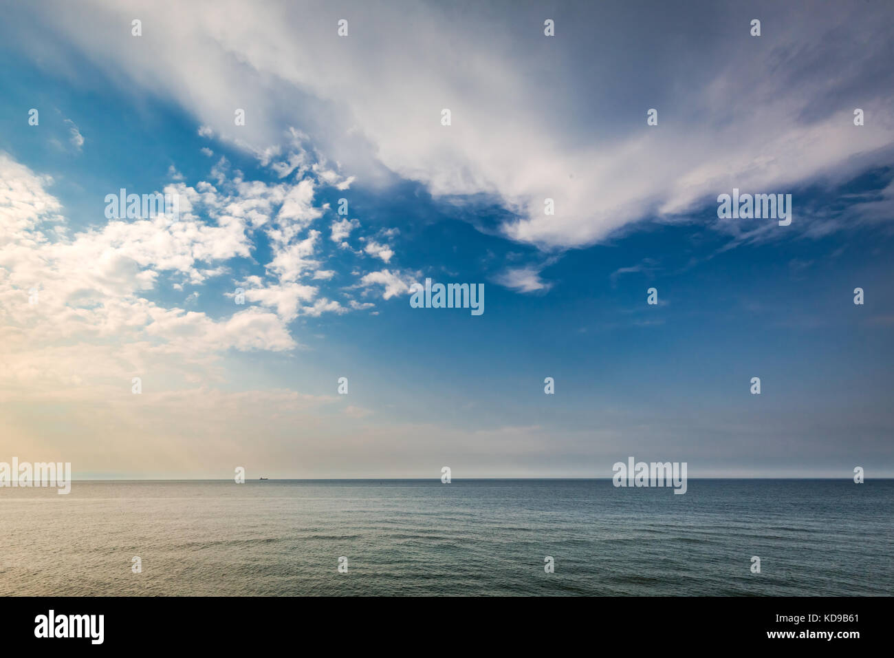 Dynamic sunset over calm sea in summer Stock Photo - Alamy