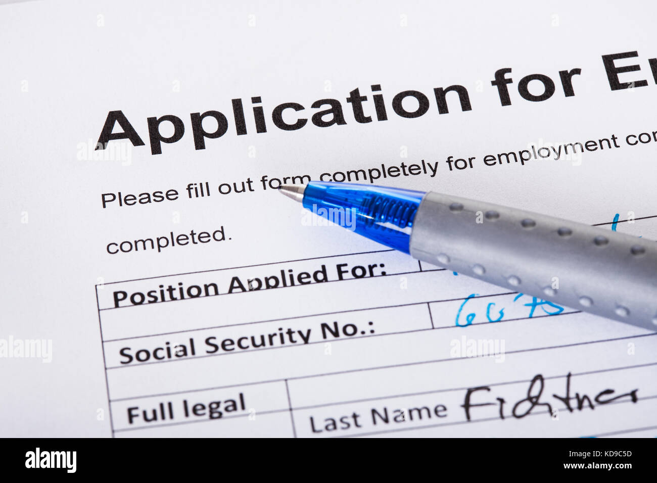 Closeup of filled application of employment and pen Stock Photo