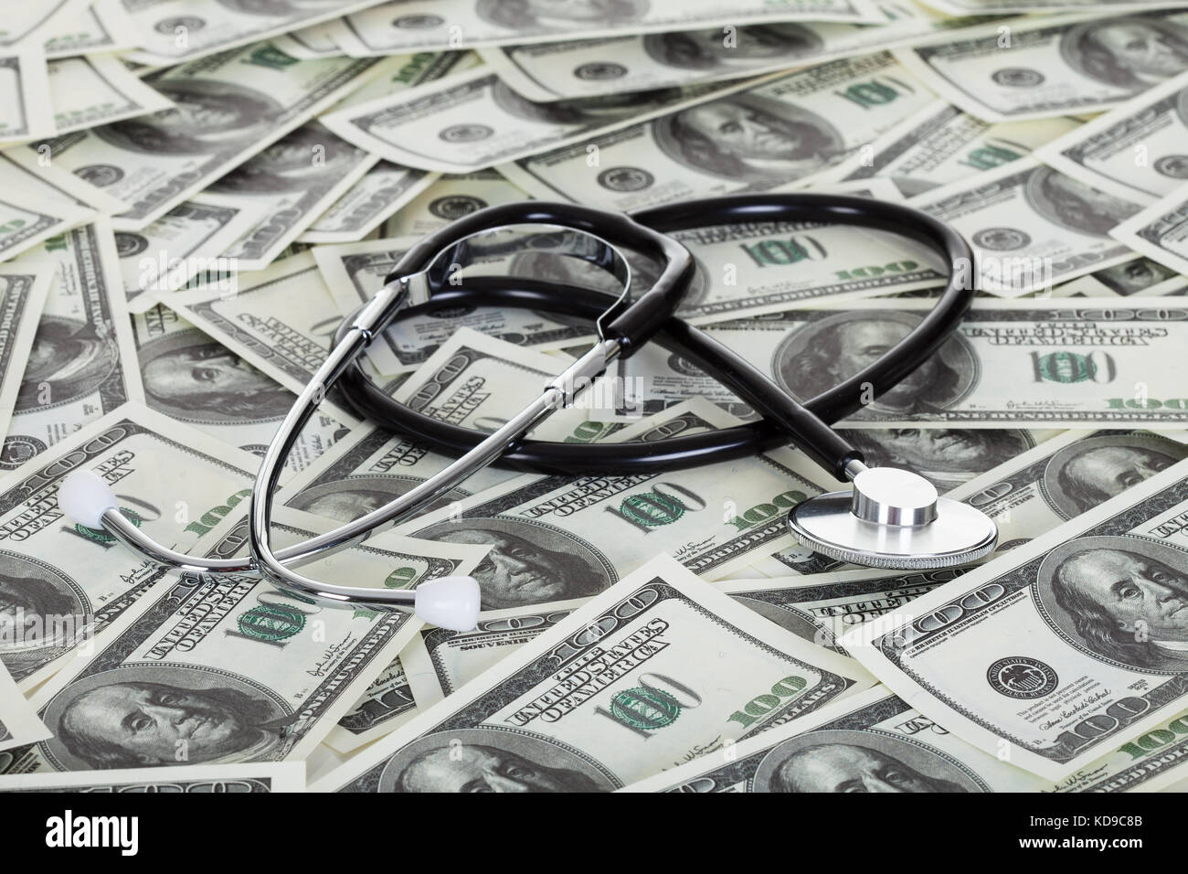 Photos of stethoscope and american dollar notes Stock Photo