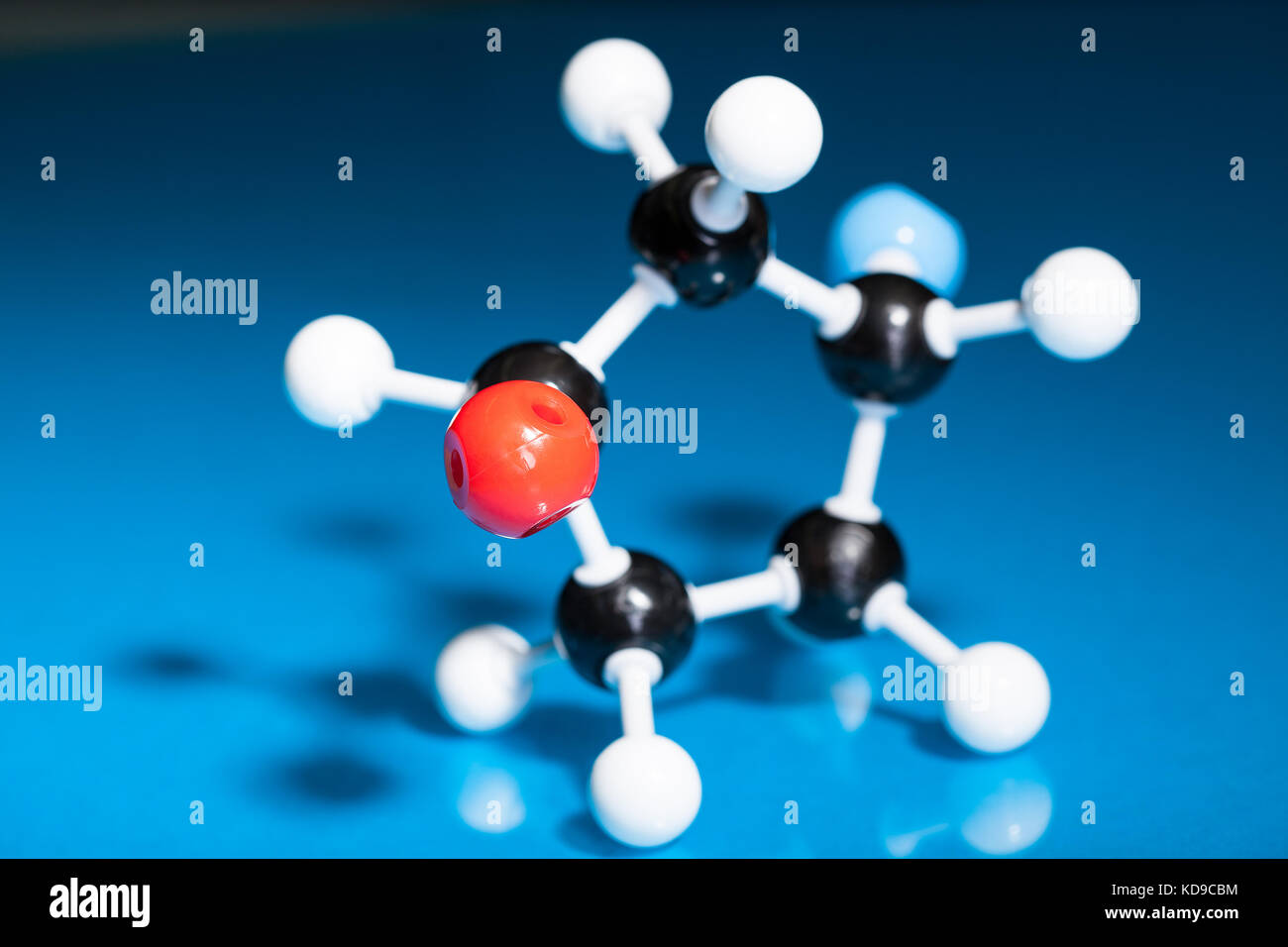 Model of molecular structure on blue reflective background Stock Photo ...