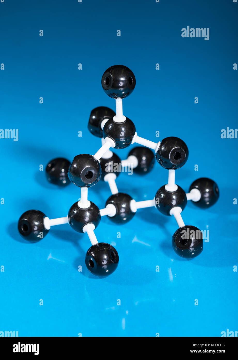 Model of graphite molecular structure on blue reflective background