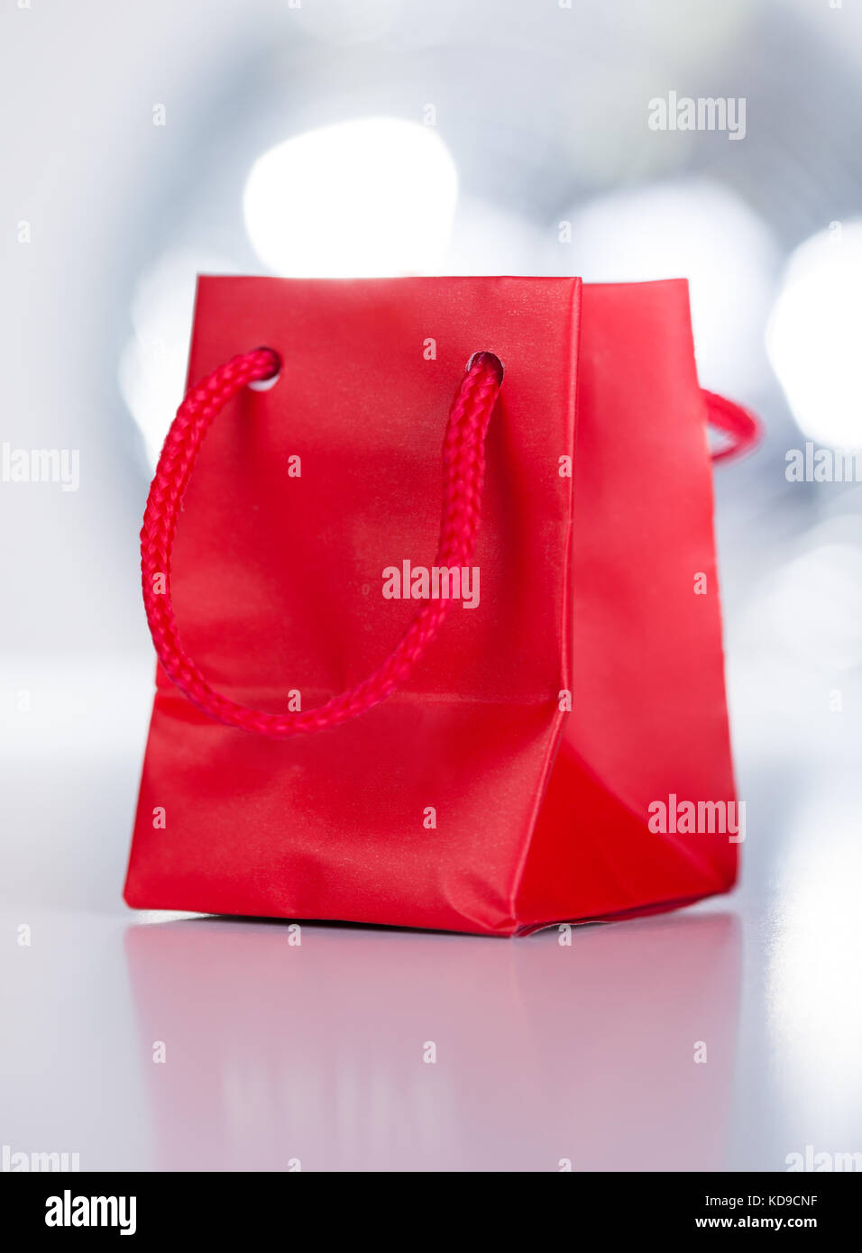 Closeup Of A Red Gift Bag With White Ribbon Stock Photo Alamy