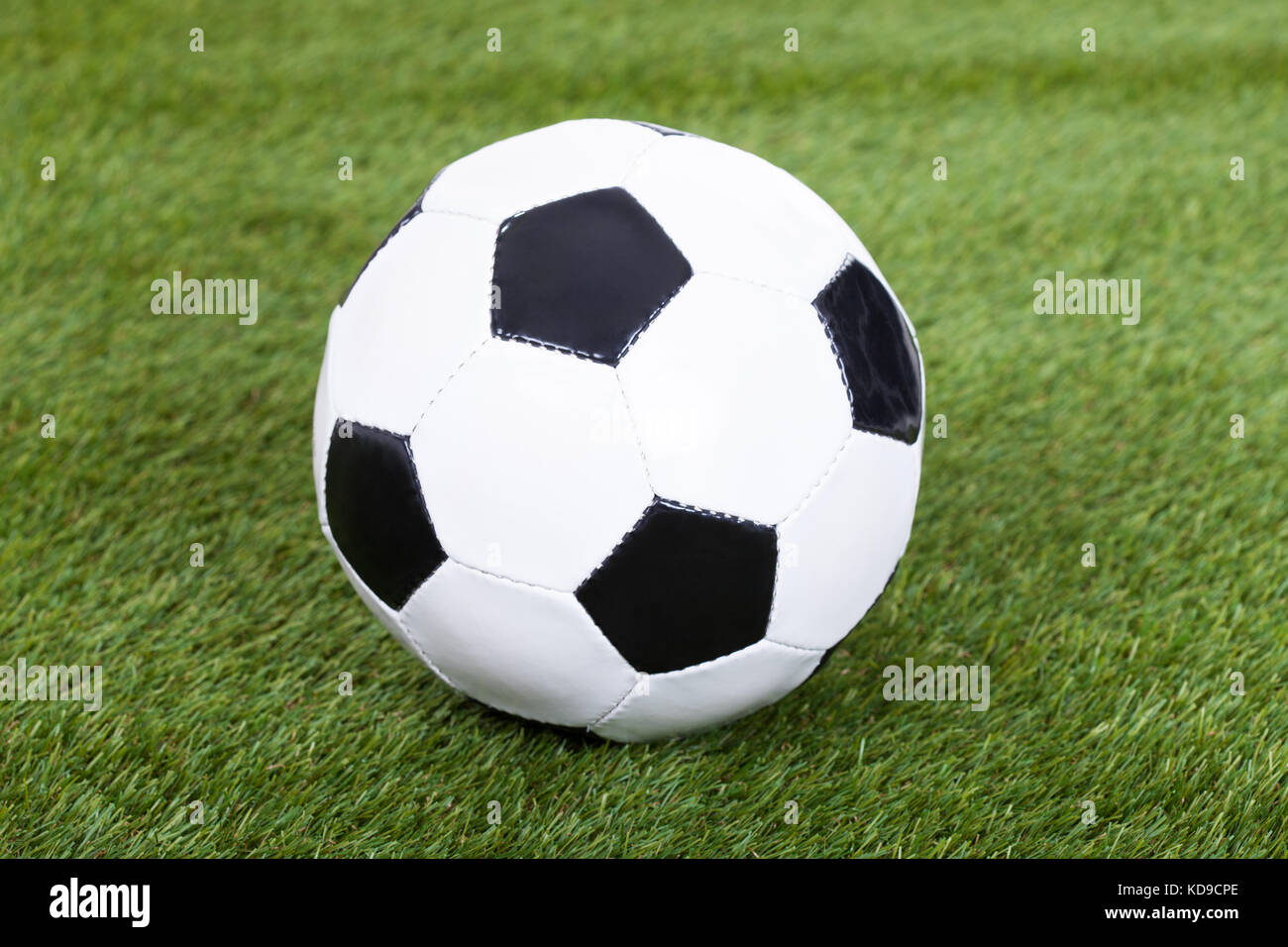 Close-up Of A Soccer Ball On Green Grass Stock Photo