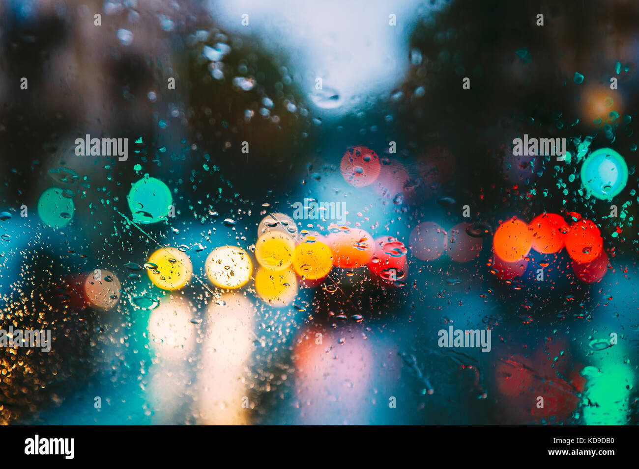 Drops Of Rain Water In Night Or Evening Street Lights On Blue Glass ...
